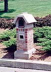 limestone and brick mailbox